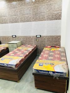 Bedroom Image of Home Living PG & Accommodation in Laxmi Nagar