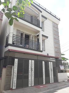 बिकासीपुरा में एसएनके लेडिज पीजी में बिल्डिंग की तस्वीर