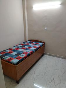 Bedroom Image of Dharam Girls PG in Sector 19